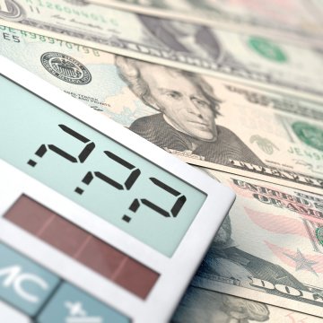 advanced system repair pro system optimizers price cost pocket calculator with question marks on the display dollar bills in the background